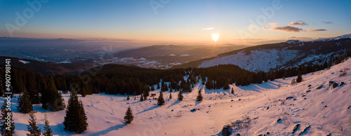Panoramic view of the snowy Vitosha mountain during the sunset in Sofia, Bulgaria photo