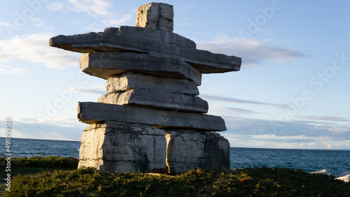 Canvas Print Inukshuk sculpture with large stacked and balanced rocks