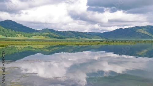 Picturesque mountain lake in morning, Altai. Beautiful reflection of mountains