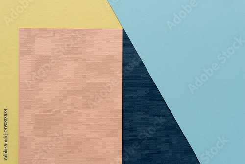 blue, yellow, and pink paper backdrop