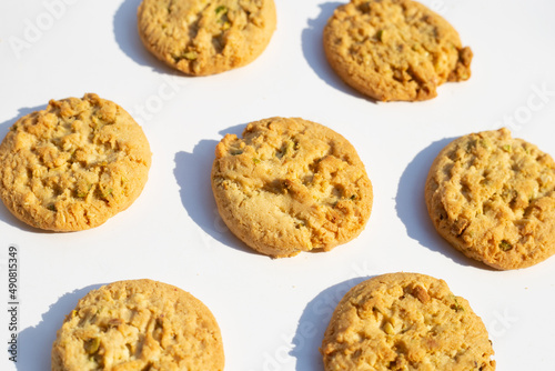 Pistachio and almond cookies on white background. © Bowonpat
