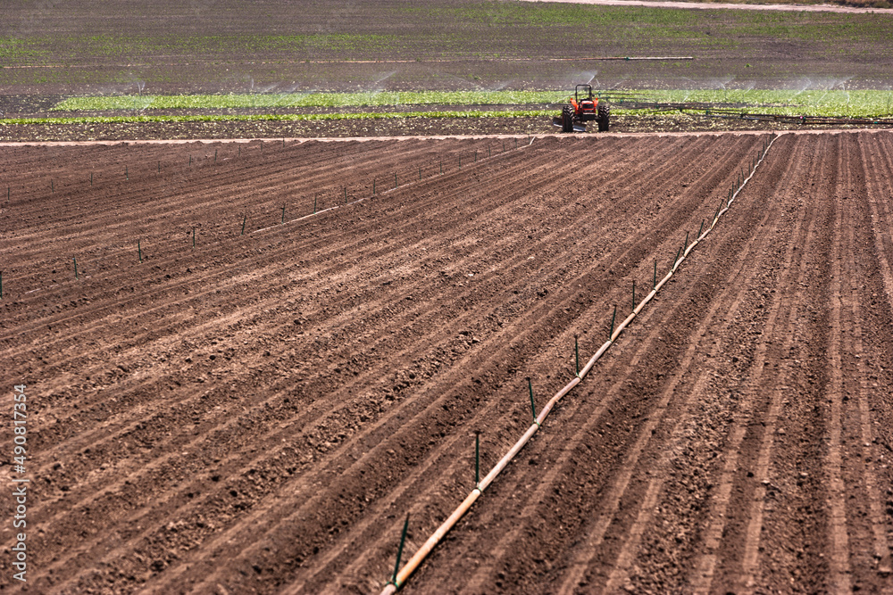 Tractor plowing field, Lompoc, Central California Tractor plowing field, Lompoc, Central California