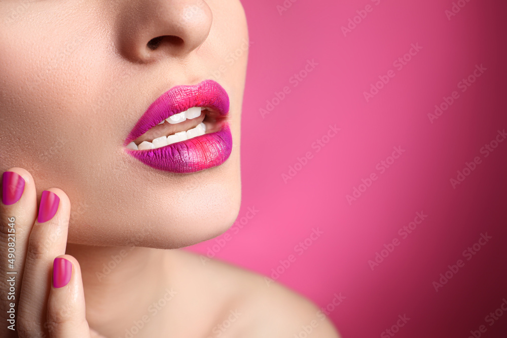 Young woman with beautiful lips makeup on pink background, closeup. Space for text Young woman with beautiful lips makeup on pink background, closeup. Space for text