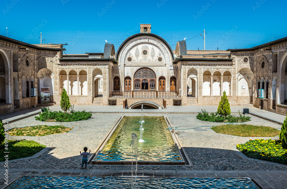 View on pool in historic house of Tabatabaei family in old part of Kashan, Iran