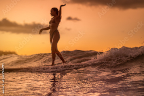 Abstract Sunset Female Surfer Silhouette © bartsadowski