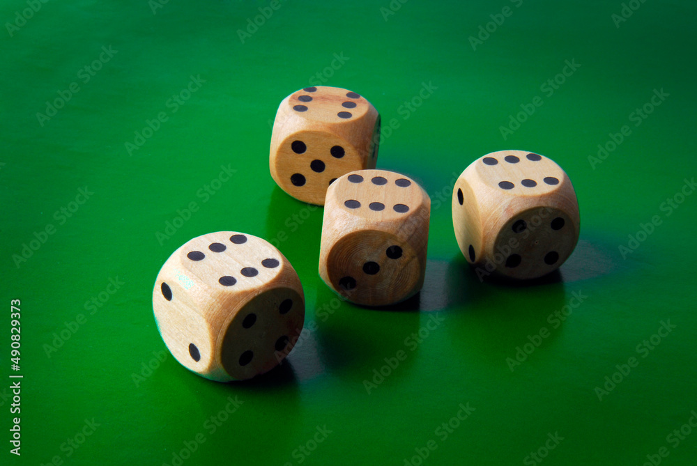 close up of dices on green backgound close up of dices on green backgound