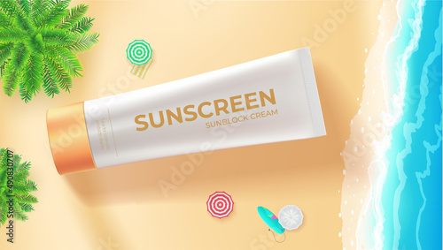 Tube of sunscreen cream on beach, top down view.