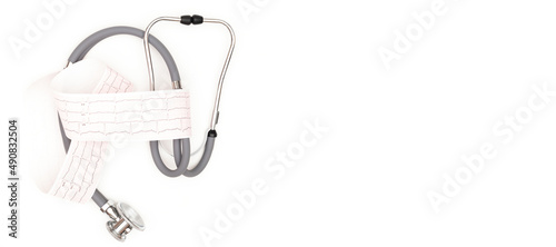 Stethoscope with electrocardiogram sheet isolated on white background. Place to copy paste.