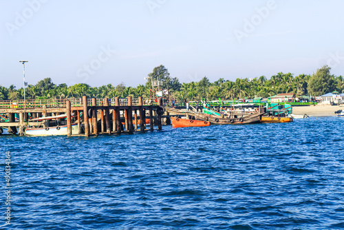 Tourist jetty of St. Martin's Island, Bangladesh. Photo of a seaport on an island with many ships docked. Good to use for outdoor and something about facilities or transporter content.
