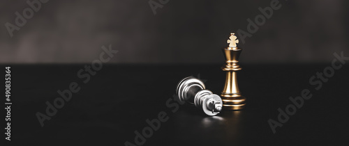 Photography Close-up king chess standing on falling chess concepts of wining to challenge or battle fighting of business team and leadership strategy and organization risk management or team player