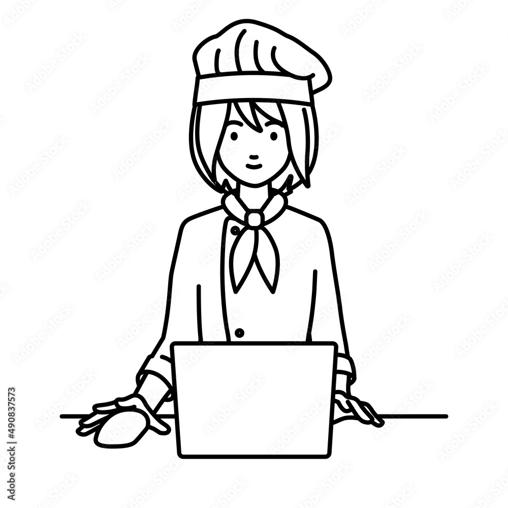 デスクで座ってPCを使っている調理師の女性
