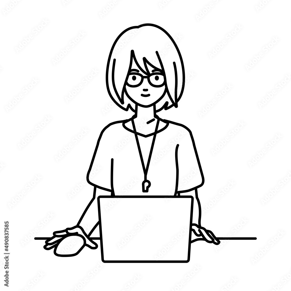 デスクで座ってPCを使っている教師の女性
