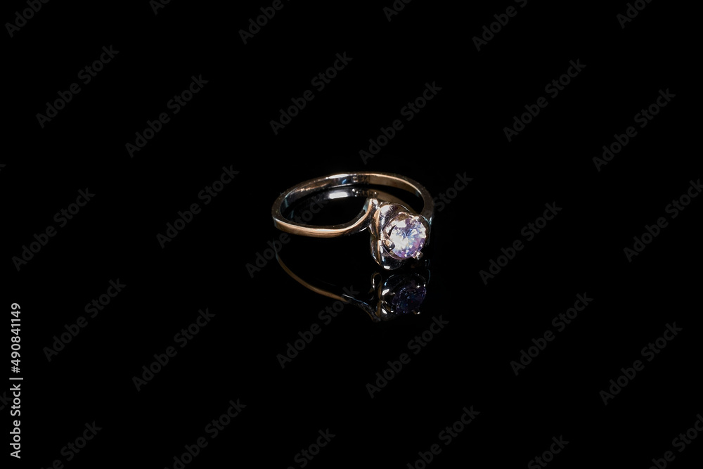 Silver diamond ring on a black background Silver diamond ring on a black background