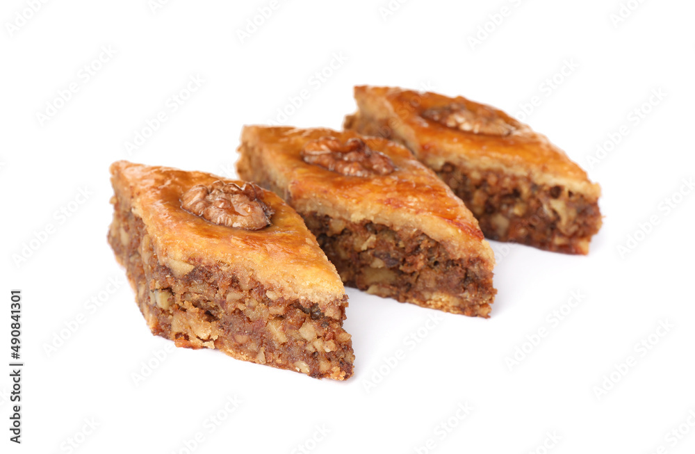 Delicious honey baklava with walnuts on white background Delicious honey baklava with walnuts on white background