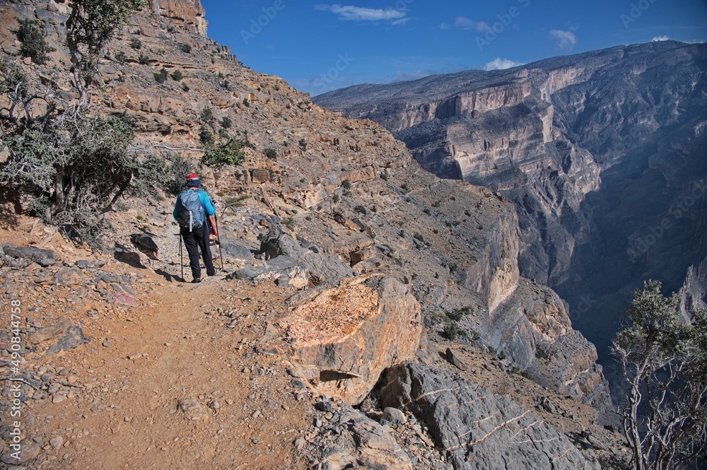 Senior woman walking at the edge of canyon