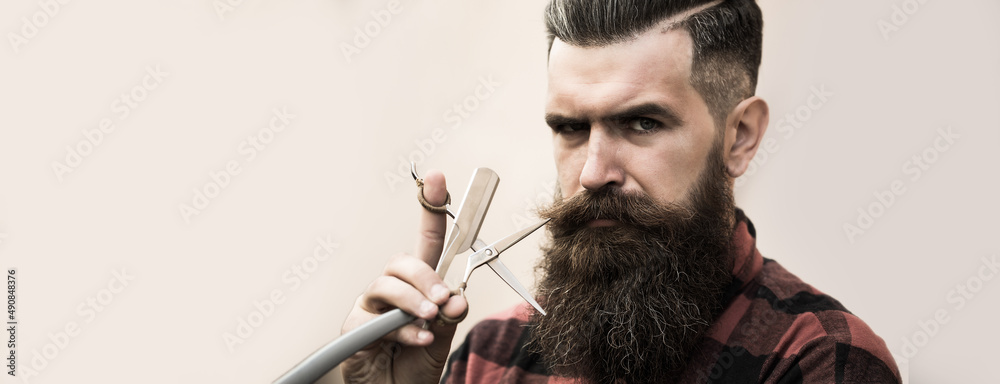 Hairdresser scissor and man retro razor. Bearded man, bearded male.  Portrait of stylish man with classic long beard. Barber scissors, barber  shop. Vintage barbershop. Banner for hair salon. Stock Photo | Adobe