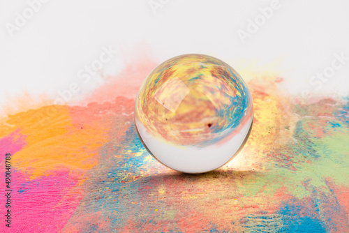 Crystal ball on colour background, space for text.