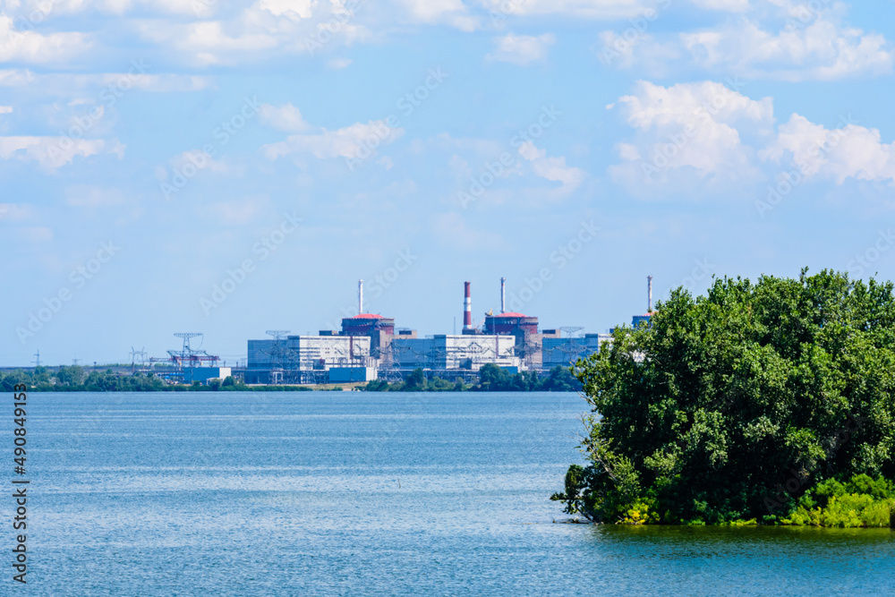 Obraz premium Smoke pipes and buildings of Zaporizhzhia Nuclear Power Station near the city Enerhodar, Ukraine