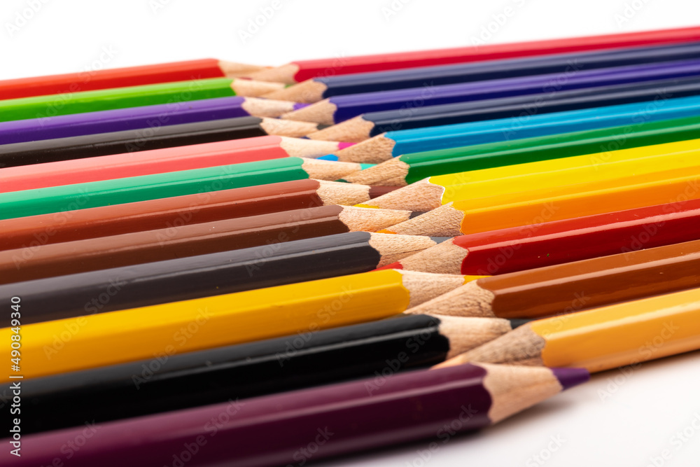 Many multicolored pencils, isolated on white background with copy space. Art and education background. Many multicolored pencils, isolated on white background with copy space. Art and education background.