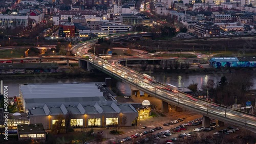 Timelapse of traffic at dusk crossing river Seine in Rouen, France photo