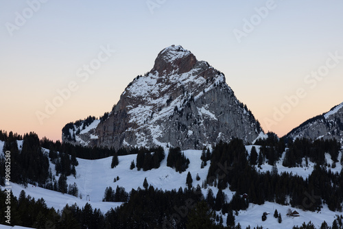 Amazing morning view and an epic sunrise with pink and blue tones. Epic long exposure shot in the heart of Switzerland. Wonderful scenery with the mountain called Grosser Mythen in the background.