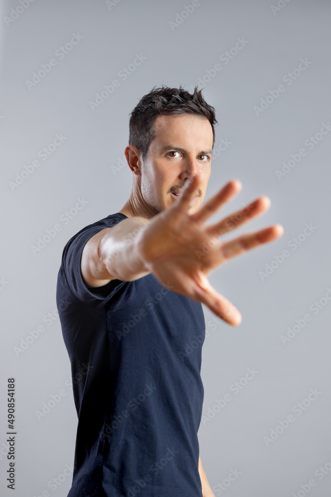 Angry man showing stop sign with hand, no objection gesture. Angry man showing stop sign with hand, no objection gesture.