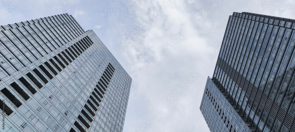 Group of Common modern business skyscrapers, high-rise buildings, architecture raising to the sky in Jakarta, Indonesia. Concepts of financial, economics, future etc. Group of Common modern business skyscrapers, high-rise buildings, architecture raising to the sky in Jakarta, Indonesia. Concepts of financial, economics, future etc.