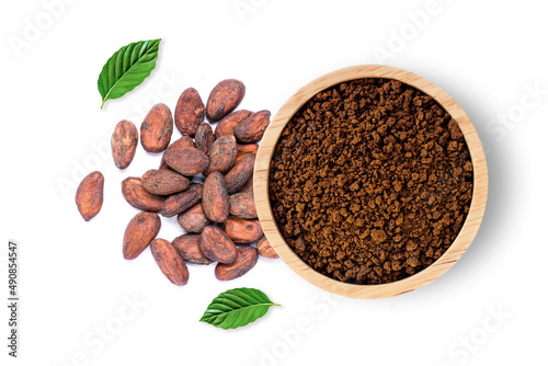 Cocoa powder in wooden bowl and cacao beans with green leaf isolated on white background. Top view. Flat lay.