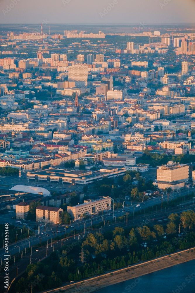 Panoramic summer shot from above of Kazan city. Capital of the Tatarstan, Russia. City centre and landmark. Residential buildings and attractions. Kazanka river, Bauman street, cars, hotels. Torism. 