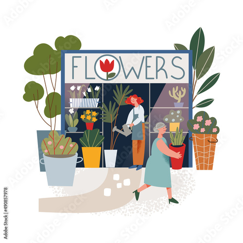 Small flower shop in local market with florist, woman buying plant in floristry stall