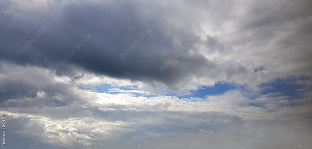 Gray clouds on blue sky background