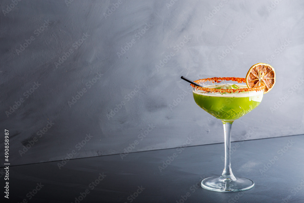 custom made wallpaper toronto digitalClose up single view of Green margarita with salt and sliced lemon from studio. Includes copy space.