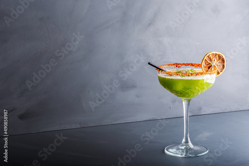 Wallpaper Mural Close up single view of Green margarita with salt and sliced lemon from studio. Includes copy space. Torontodigital.ca