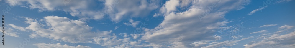 Panoramic blue sky background with white clouds during day