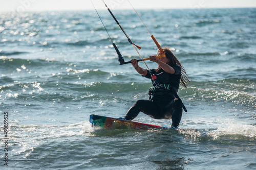 Woman kitesurfing on the ocean waters