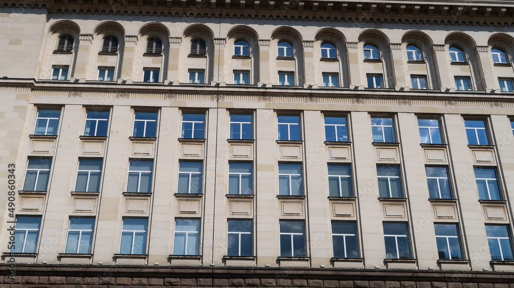 Front view window architecture of monumental, communist-era shopping mall in Sofia, Bulgaria