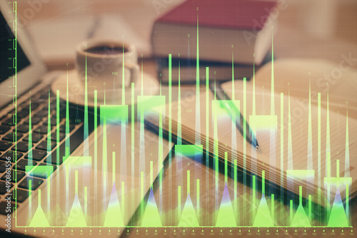 Double exposure of financial chart drawing and desktop with coffee and items on table background. Concept of forex market trading © peshkova