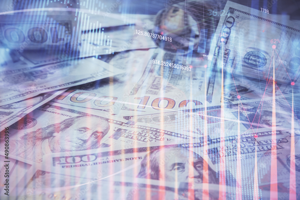 Multi exposure of forex chart drawing over us dollars bill background. Concept of financial success markets. Multi exposure of forex chart drawing over us dollars bill background. Concept of financial success markets.
