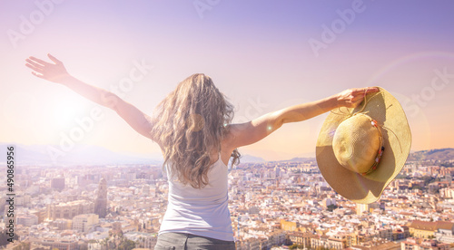 Quadro su tela woman traveler looking at city landscape view panorama- Malaga