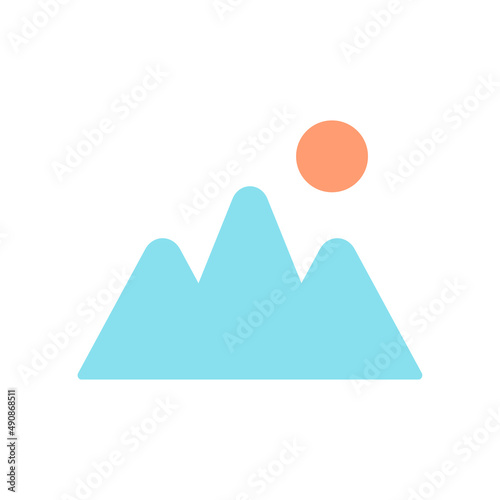 Mountain with the sun shining from behind.