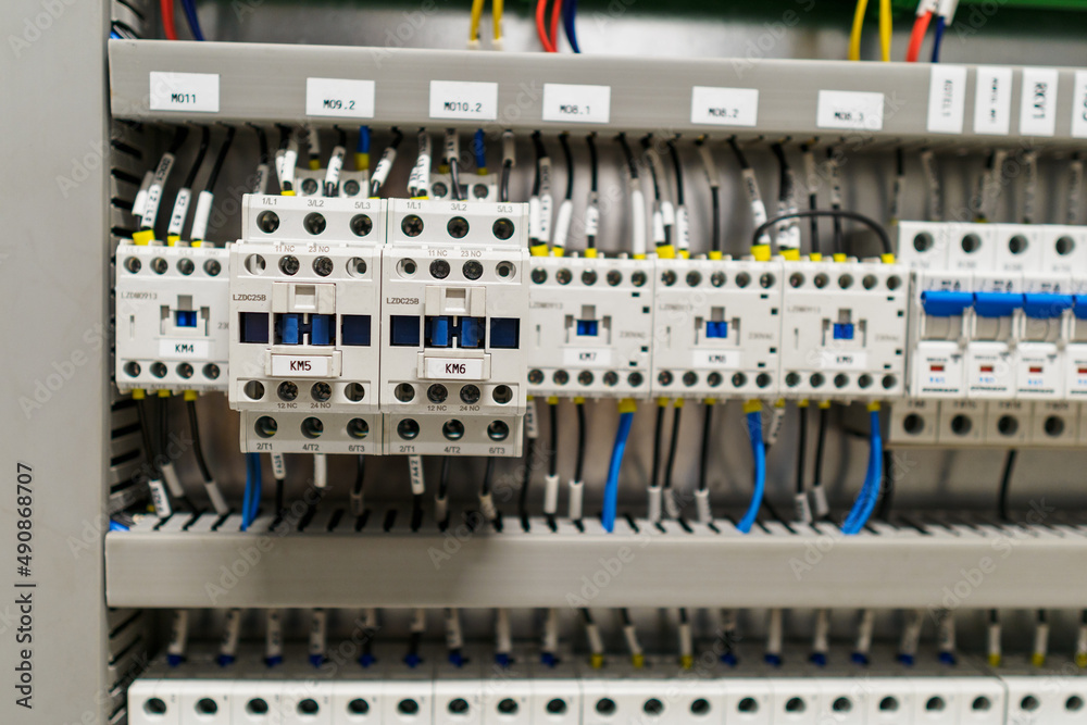 Contactors in a row in a switchboard.