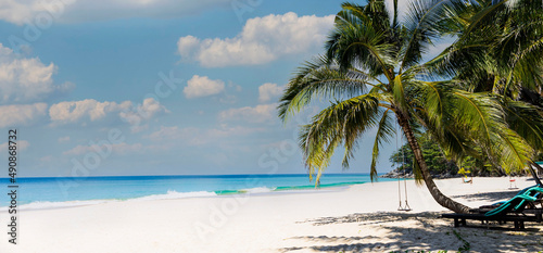 The banner of summer and Palm tree as the white sand Beach - Happy Tropical with a Vacation Holiday concept