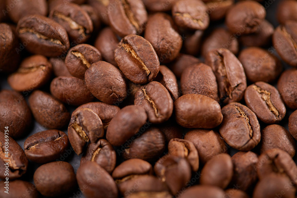 coffee beans on the wooden background coffee beans on the wooden background