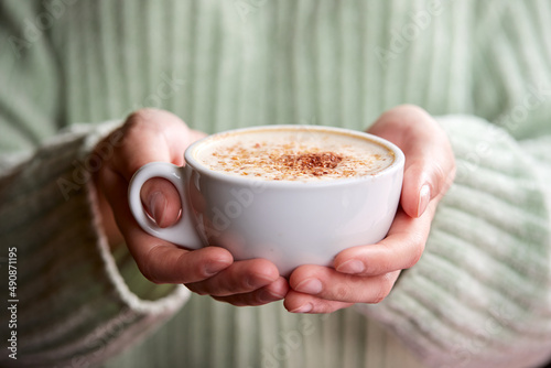 woman with cup of cappuccino