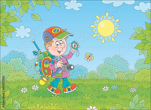 Cheerful little boy backpac...