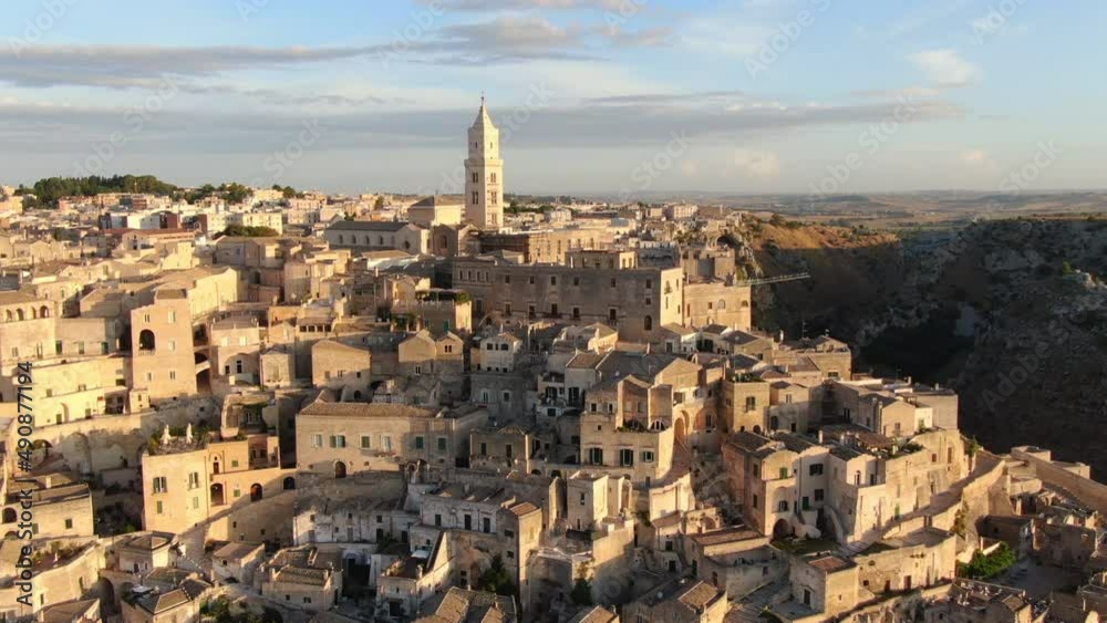 sassi di matera old town aerial view drone flying backwards revealing the historic city center,panoramic wide view 4k sassi di matera old town aerial view drone flying backwards revealing the historic city center,panoramic wide view 4k