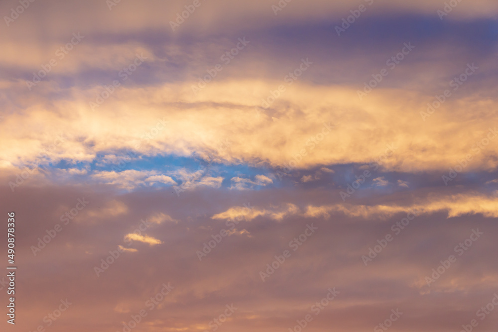 Colorful sunset in the sky. Beautiful sunset sky above clouds.