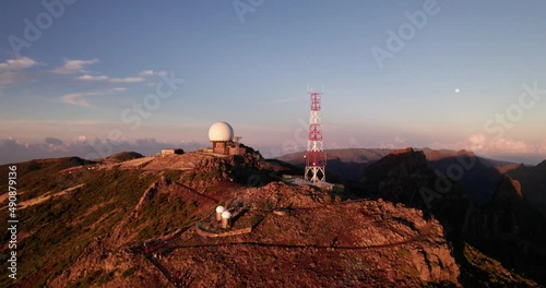 Drone over the mountains at sunrise around a telescope on the island of madeira