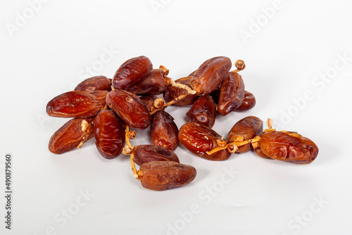 Dried dates (fruit of Phoenix dactylifera dates). Clipping paths for both the object and the shadow. Infinite depth of field, retouched. Set, bundle, photo