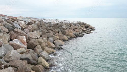 Panoramic view of the cliff and promenade of Marina di Pisa, Italy, on a cloudy day photo